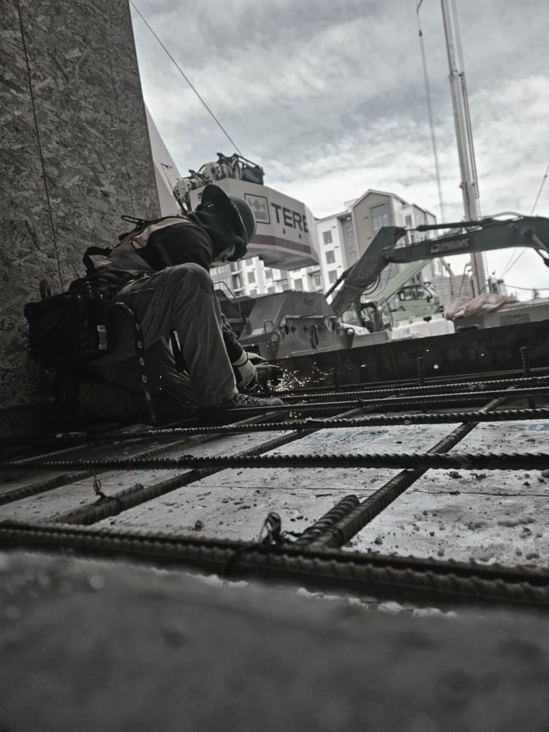Construction crew working on elevated formwork and reinforcement for a concrete slab at an active job site. Victory Group Co provides reliable carpentry, formwork assistance and construction labour support for commercial building projects in Calgary, Alberta.
